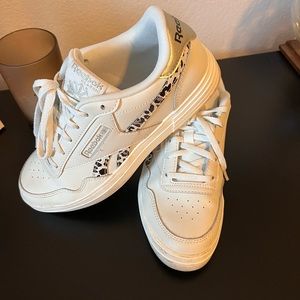 Reebok white sneakers.